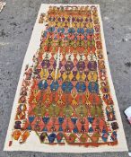 Kilim carpet fragments, woven with lozenge-shaped bands in green, red, blue and purple within