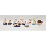 Collection of Staffordshire pottery models of dogs and other items including a Dalmation seated on