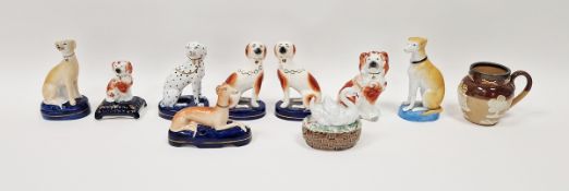 Collection of Staffordshire pottery models of dogs and other items including a Dalmation seated on
