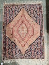 Small North West Persian carpet, woven with a large central lozenge-shaped medallion in pink and