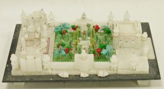 Vintage alabaster model of the Taj Mahal, the building centred by a fabric and wire garden, raised