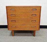 Mid-century teak chest of drawers by Poul Hundevad, the four drawers with recessed handles, raised