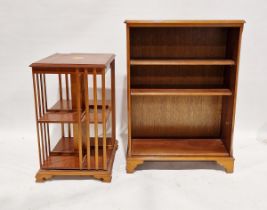 Modern veneered revolving bookcase with banded decoration and inlaid marquetry to top, 81cm high x