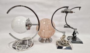 Four vintage chromed lamps, the first with opaque glass globe shade with concentric frame on domed