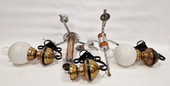 Two 1960's chromed pendant lights, each issuing three lights, one with copper column support and the
