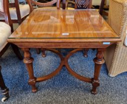 Mahogany coffee table of square form raised on four legs with X-section stretcher, 50cm high x