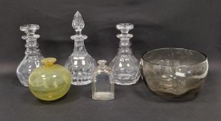 Three cut glass decanters and stoppers, a yellow tinted globular vase, a 19th century gilt glass