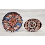 Late 19th century Japanese Imari fluted circular dish, decorated with a central mon flanked by