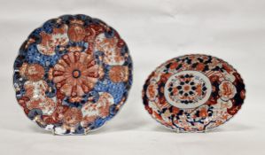 Late 19th century Japanese Imari fluted circular dish, decorated with a central mon flanked by