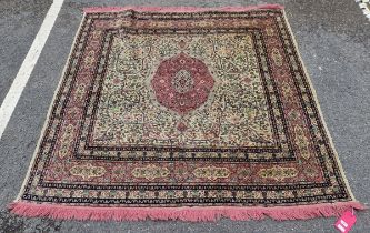 Middle Eastern pink and green ground rug, the central pink and green foliate medallion reserved