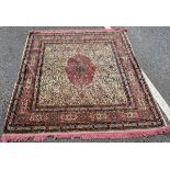 Middle Eastern pink and green ground rug, the central pink and green foliate medallion reserved
