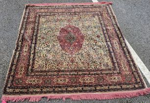 Middle Eastern pink and green ground rug, the central pink and green foliate medallion reserved