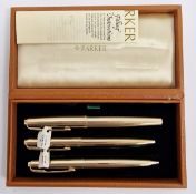 Vintage cased set of three rolled gold Parker Insignia pens, comprising a fountain pen, a