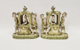 Pair of Continental porcelain sedan chair groups, circa 1900, each modelled with a lady carried in a