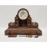 Large 19th century oak-cased mantel clock, the circular dial having Roman numerals denoting hours,