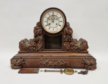 Large 19th century oak-cased mantel clock, the circular dial having Roman numerals denoting hours,
