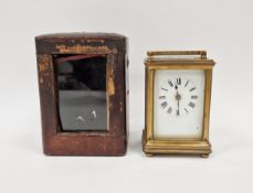 Late 19th century brass-cased carriage clock, the enamel front with Roman numerals denoting hours,