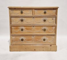Stripped pine chest of drawers, with two short drawers above three long graduating drawers, each