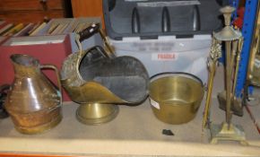 Brass coal scuttle with wooden carry handle and embossed decoration, a large copper jug, a brass jam