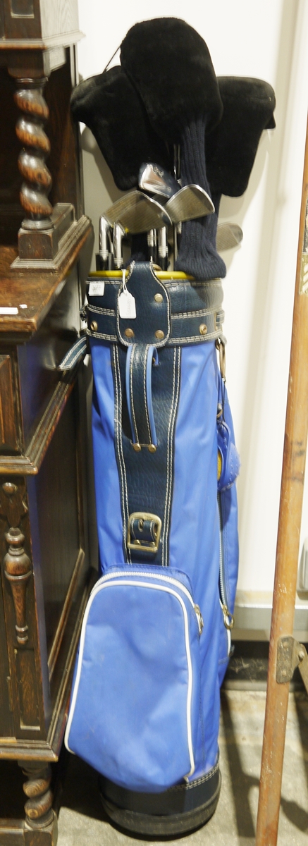 Set of golf clubs within carry bag, the clubs are marked 'Wilson'  Condition Report Additional