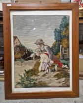 Modern framed tapestry showing an Edwardian scene of two children fishing, within a wooden frame