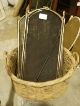 Two folding spark guards, a large wicker basket and a riding crop (4)