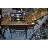 Vintage Singer treadle sewing machine, which swings out from fitted table, 56cm wide x 41cm deep x