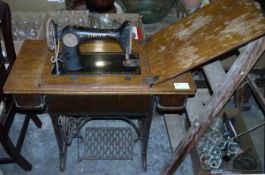 Vintage Singer treadle sewing machine, which swings out from fitted table, 56cm wide x 41cm deep x