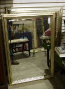 Two large modern framed mirrors, the frames silvered, bevelled edges to the mirrors, 111cm x 79cm to