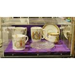 Four royal commemorative mugs, Victoria, Elizabeth II, George V and George VI and Elizabeth II glass