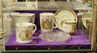 Four royal commemorative mugs, Victoria, Elizabeth II, George V and George VI and Elizabeth II glass