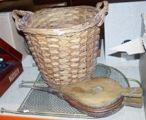 Brass-coloured folding spark guard, a pair of wooden bellows and a log basket (3)