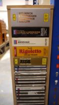 CD holder with a large collection of CDs, mainly classical and a box of long playing records, mainly
