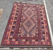 Afghan kilim, woven with central lozenge-shaped double medallion in black, blue and deep purple