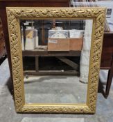 Gilt framed rectangular wall mirror with bevelled plate, the frame decorated with fruit and vine, '