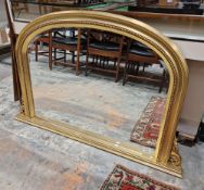 20th century arched gilt framed over mantle mirror with bevelled plate, 79cm x 122cm