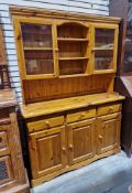 20th century pine kitchen dresser, the top section having two single glazed cupboard doors