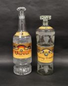 Two empty vintage glass Armenian brandy bottles with stoppers, the first Apapat Serog Odette, 20