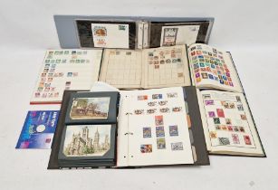Collection of first day covers, assorted stamp albums and postcards including The First Man on the