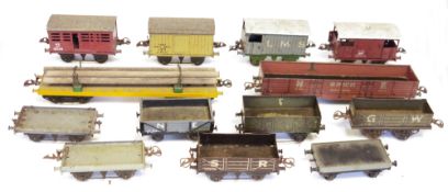 Two boxes of Hornby and other goods O gauge rolling stock to include open wagons, log carrier etc