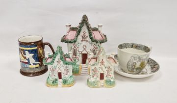 Three 19th century Staffordshire pottery models of gothic cottages in two sizes, applied with
