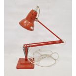 LOT WITHDRAWN Herbert Terry orange anglepoise lamp, stamped to column, on stepped base, electrified