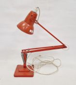 LOT WITHDRAWN Herbert Terry orange anglepoise lamp, stamped to column, on stepped base, electrified
