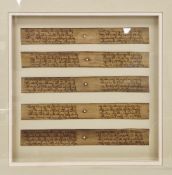 Five reproduction Asian written palm leaves, depicting religious plaques, framed and glazed