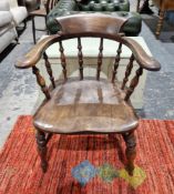 Antique stained elm/oak smokers bow armchair with ring baluster turned spindles, on baluster