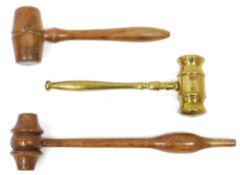 20th century brass gavel with baluster handle, 18cm long and two turned wood examples (3)