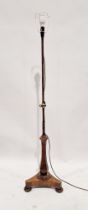 Victorian stained wooden telescopic standard lamp raised on tripod base, on bun feet, 145cm high