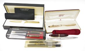 Collection of ball point pens, cased, including a Dunhill gilt engine-turned ball point pen, a Cross