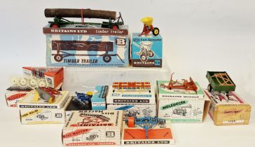 Boxed Britains farming implements to include 9538 vari-spreader, 9560 timber trailer, 9537 acrobat