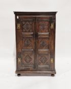 Antique oak side cabinet having two shelves enclosed by pair framed panel doors, all with lozenge
